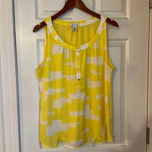 Bright yellow, sleeveless blouse.